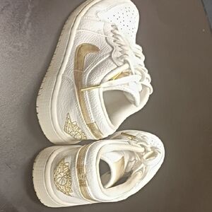 Women's Air Jordan White and Gold Athletic Shoes